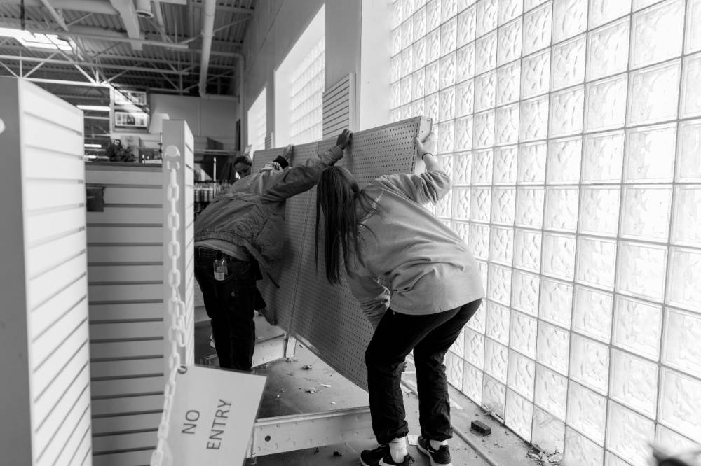Participants help move shelves at Restore.